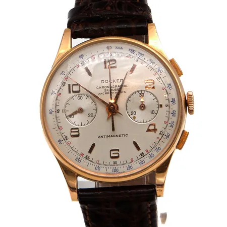 Kultarannekello Docker, Chronographe Suisse, 17 kivinen, taulun Ø 38mm, nahkaranneke, mekaaninen, lasissa naarmuja ja takanannessa pieniä painaumia, nahkaranneke, 750br Paino: 46,6 g