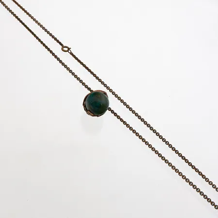 Kaulakoru, Tintti, Kalevala, ketjun pituus 81cm, riipuksen korkeus 27mm, pronssia