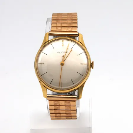 Kultarannekello Glycine, kaiverrettu, mekaaninen, taulun Ø 33,0mm, metalliranneke, 585br,