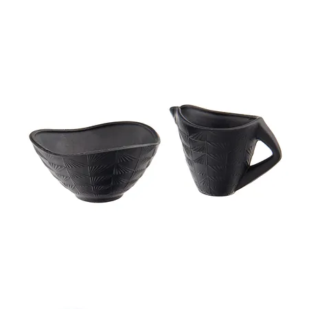 Sokerikko ja kermakko, sokerikon reunassa lohkeamia. 