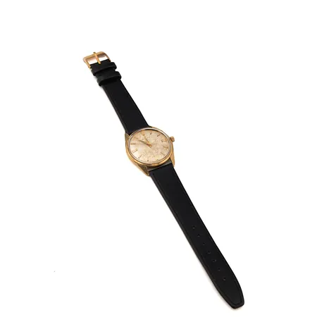 Kultarannekello Zenith nahkarannekkeella, mekaaninen, taulun Ø 35mm, kaiverrettu, 750br Paino: 39 g