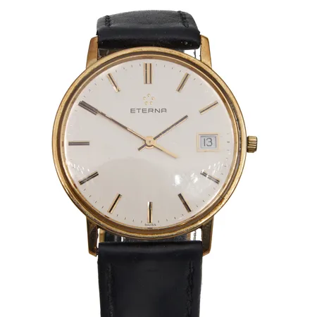 Kultarannekello Eterna, quartz:, paristo loppunut, rungon Ø 33,5mm, 585br, ranneke kulunut, rannekkeen pituus 160-200mm, lasissa naarmu. Paino: 27,7 g