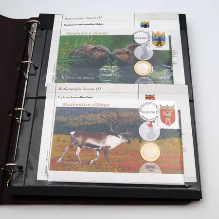 Rahakirjeitä, 18 kappaletta, Pohjolan luonto ja maakuntien eläimet kansioissa, nimellisarvo 70 euroa ja 15 markkaa 60 penniä