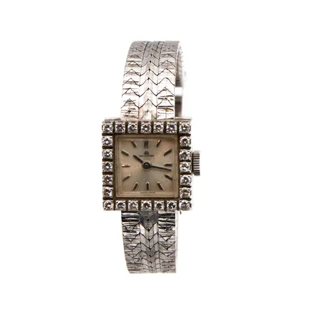 Viallinen kultarannekello Bucherer timanteilla 24xn.0.02ct, taulun koko 16,6x16.6mm, rannekkeen pituus 170mm, 750br valkokulta, Paino: 44,4 g