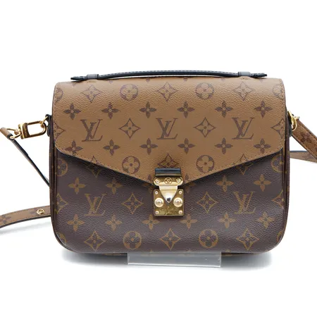 Olkalaukku Louis Vuitton, Pochette Métis MM Monogram Reverse Canvas, M44876, mitat 25x20x7cm, Made in France, metalliosassa kulumaa, käytön jälkiä, laukun sisällä likaa, irroitettava olkahihna, alkuperäinen ostokuitti 13.2.2023 Louis Vuitton Helsinki,