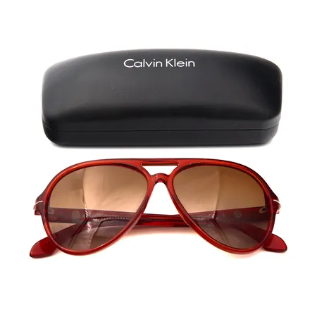 Aurinkolasit, Calvin Klein, ck419S 286 140 ja kotelo.