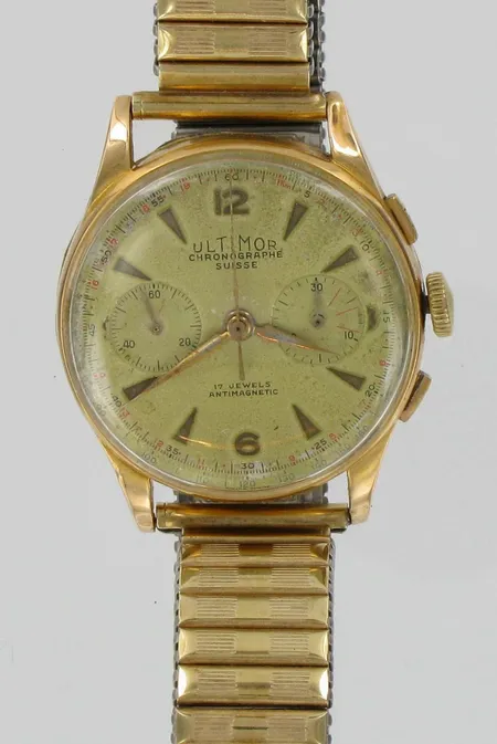 Miesten kultarannekello Ultimor chronographe, 17 jewels, antimagnetic, kaiverrettu, rungossa kolhuja, 750br, paino 65,5g. Ranneke teräs/kulta. Vikt: 65,5 g