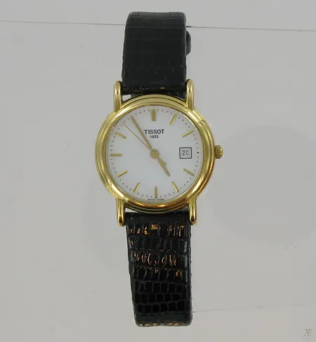 Naisten kultarannekello Tissot 1853, quartz, G617330, Øn.22mm, kaiverrettu, nahkaranneekkeella, 750br, paino 20,2g Vikt: 20,2 g