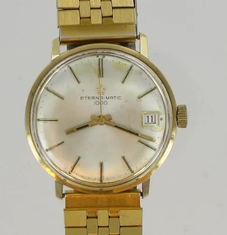 Kultarannekello Eterna-Matic 1000, automatic, Ø 34mm, 585, taulussa käytön jälkiä, metalli rannekkeella.