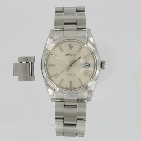 Miesten teräsrannekello Rolex Oysterdate Precision, mekaaninen, kaiverrettu, pieniä naarmuja lasissa, taulun Ø n.37mm, hihnan pituus n.162mm, mukana yksi lisäpala, laatikko  ja todistus.
