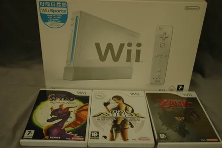 Nintendo Wii-pelikonsoli, virtalähde, peliohjain viallinen, ohjekirjat, kolme peliä Zelda, Spyro ja Tomb Raider