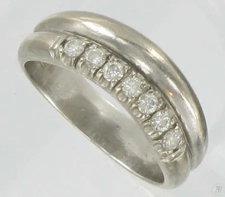 Timanttisormus 7xn.0.03ct, kaivertamaton, koko 16½, 750vk, paino 5,3g Vikt: 5,3 g