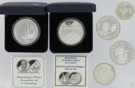 4 Hopearahaa 1=10e olympia 1952 vuosi 2002 proof, 1=10e Mannerheim 2003 proof, 1= 50markkaa , 1= 10markkaa, 2 Hopea mitalia