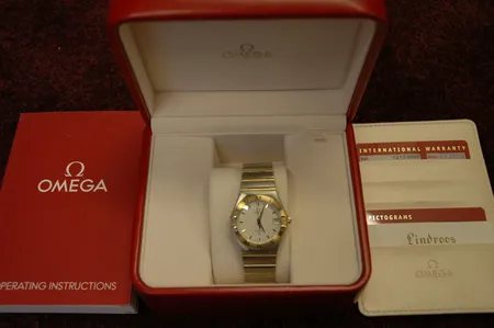Miesten teräs/kultarannekello Omega Constellation, quartz, 1212.30.00/90180296, laatikko, ohjekirja ja takuukortit ostettu 7.3.2008